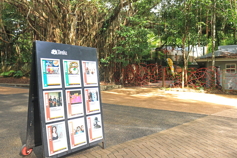 A billboard stands outside Tank 4 at the Cairns Botanic Gardens.